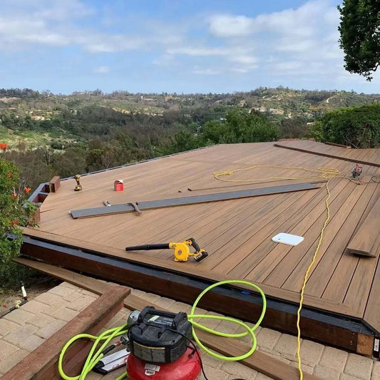 Composite decking installation in progress on an outdoor terrace