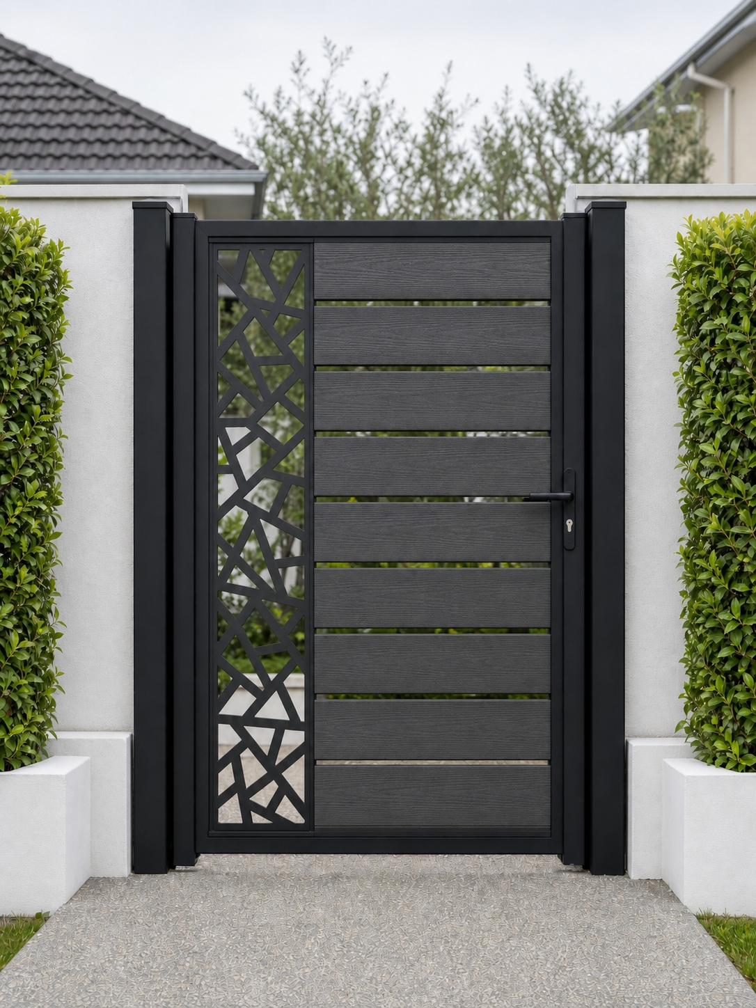 Dark grey decorative composite garden gate with WPC slats and laser-cut side screen, sleek anthracite designer finish
