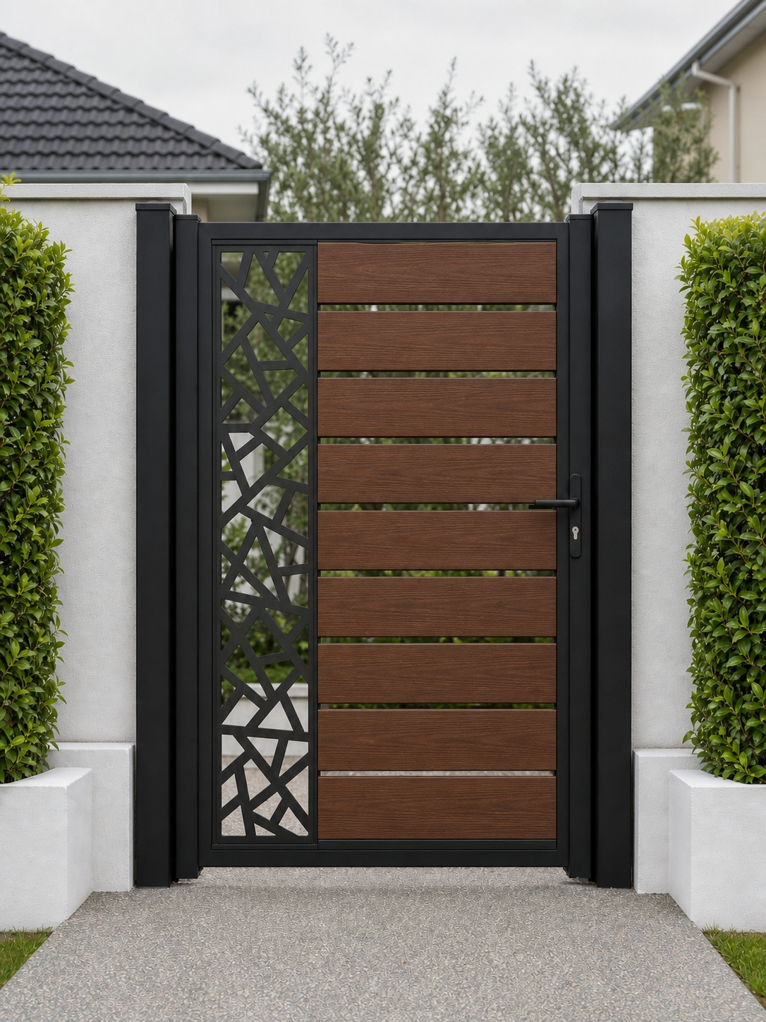 Walnut composite fence gate, horizontal WPC slats beside a laser-cut decorative side panel, rich brown wood grain