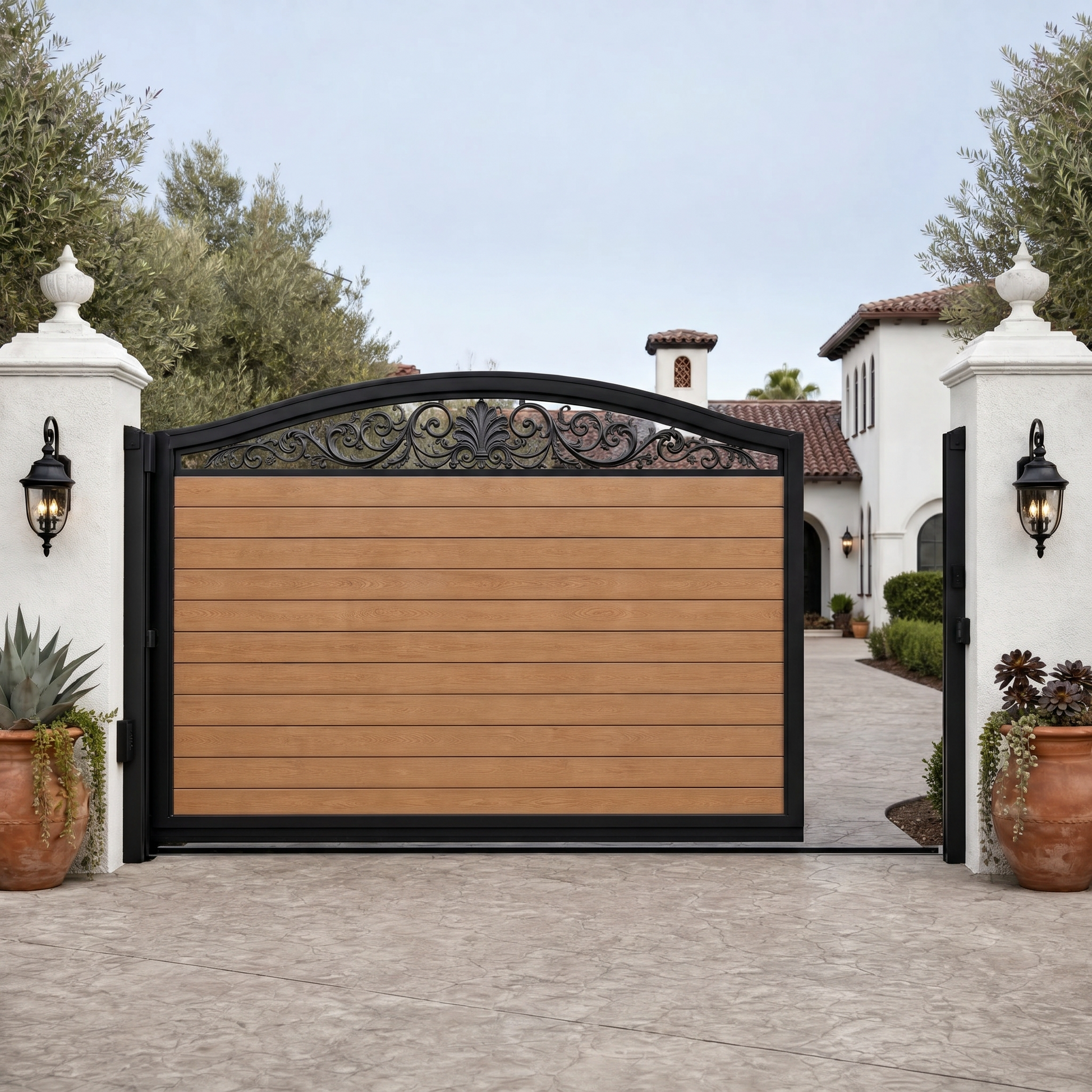 Teak automatic sliding driveway gate with horizontal WPC slats and an arched scroll top, warm golden wood, aluminium frame